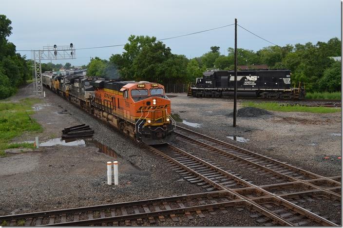 BNSF 7906-9124-8426-HLCX 3867 on e/b 117-18 (Bellevue-Chattanooga) bangs across the CSX Indianapolis Line SD diamond at AC Tower with 86 loads/67 mtys. NS yard engine parked on the interchange. 06-18-2015. Marion.